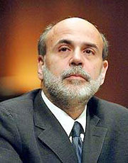 With unemployment high and inflation very low, Bernanke defended the Fed's $600 billion bond-buying program.